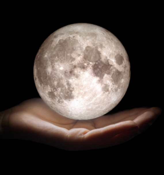 moonlighting - hand holding moon